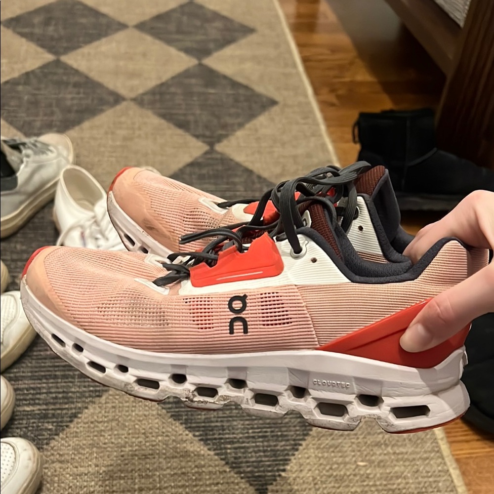 On Running Cloudstratus Sneakers in Pink and Red